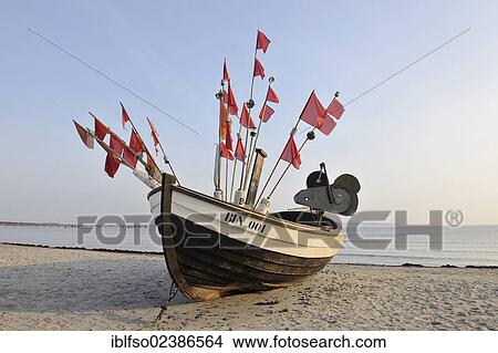 "Fishing boat on the beach of the Baltic Sea resort town of Binz, Ruegen, Mecklenburg-Western Pomerania, Germany, Europe" View Large Photo Image Picture - "Fishing boat on the beach of the Baltic Sea resort town of Binz, Ruegen, Mecklenburg-Western Pomerania, Germany, Europe". Fotosearch
