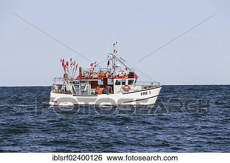 Stock Photograph - "Fishing boat on the sea, Ruegen, Mecklenburg-Western Pomerania, Germany, Europe". Fotosearch