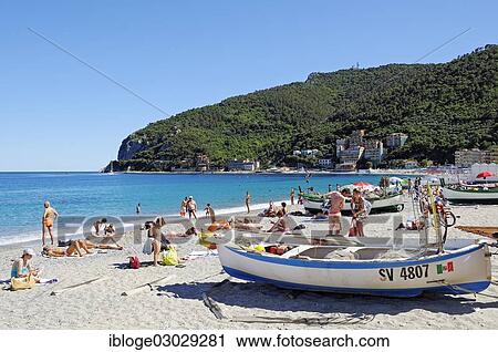 "Fishing boats and bathers on the beach of Noli, Strand, Noli, Liguria, Italy, Europe" View Large Photo Image Stock Image - "Fishing boats and bathers on the beach of Noli, Strand, Noli, Liguria, Italy, Europe". Fotosearch