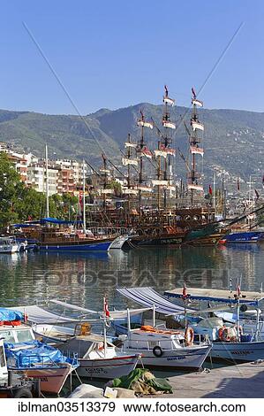 "Fishing boats and excursion boats in the harbour, Alanya, Turkish Riviera, Province of Antalya, Mediterranean Region, Turkey, Asia" View Large Photo Image Stock Photo - "Fishing boats and excursion boats in the harbour, Alanya, Turkish Riviera, Province of Antalya, Mediterranean Region, Turkey, Asia". Fotosearch