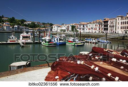 Stock Photograph - "Fishing boats and fishing nets in the fishing port of Saint-Jean-de-Luz, in Basque: Donibane Lohizune, Pyrenees, Aquitaine region, Pyrenees-Atlantiques department, France, Europe". Fotosearch