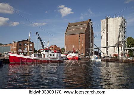 "Fishing boats and granaries in the fishing port, Burgstaaken, Fehmarn island, Schleswig-Holstein, Germany, Europe" View Large Photo Image Stock Image - "Fishing boats and granaries in the fishing port, Burgstaaken, Fehmarn island, Schleswig-Holstein, Germany, Europe". Fotosearch