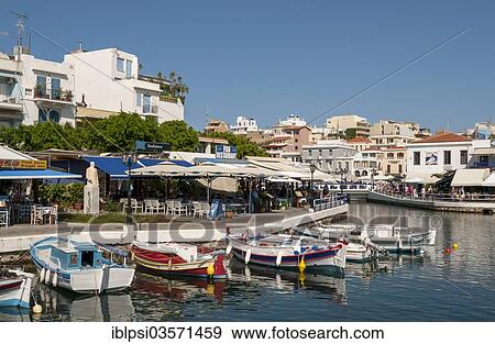 "Fishing boats and restaurants on lake Voulismeni, Agios Nikolaos, Crete, Greece, Europe" View Large Photo Image Stock Photo - "Fishing boats and restaurants on lake Voulismeni, Agios Nikolaos, Crete, Greece, Europe". Fotosearch