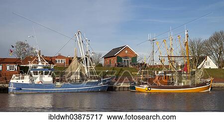 "Fishing boats in the harbor, Greetsiel, Leybucht, Krummhorn, East Frisia, Lower Saxony, Germany, Europe" View Large Photo Image Stock Photo - "Fishing boats in the harbor, Greetsiel, Leybucht, Krummhorn, East Frisia, Lower Saxony, Germany, Europe". Fotosearch
