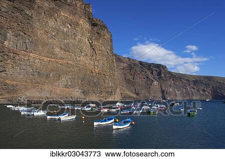 Stock Image - "Fishing boats in the harbour of Vueltas, Valle Gran Rey, La Gomera, Canary Islands, Spain, Europe". Fotosearch