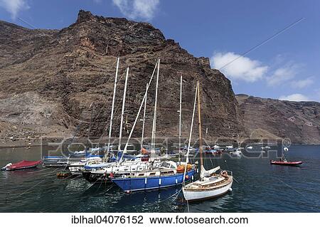 "Fishing boats in the harbour, Tequergenche at the back, Vueltas, Valle Gran Rey, La Gomera, Canary Islands, Spain, Europe" View Large Photo Image Stock Image - "Fishing boats in the harbour, Tequergenche at the back, Vueltas, Valle Gran Rey, La Gomera, Canary Islands, Spain, Europe". Fotosearch
