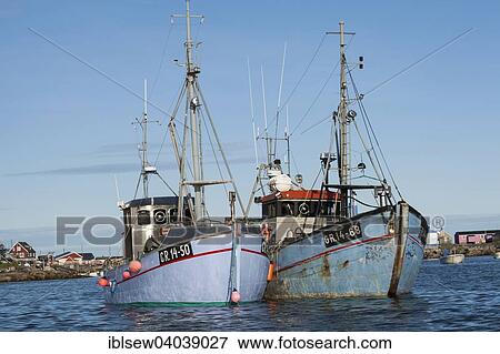 Stock Photo - "Fishing boats in the harbour, Qeqertarsuaq, Greenland, North America". Fotosearch