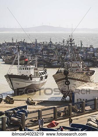 "Fishing boats in the port of Essaouira, Unesco World Heritage Site, Morocco, Africa" View Large Photo Image Stock Photo - "Fishing boats in the port of Essaouira, Unesco World Heritage Site, Morocco, Africa". Fotosearch