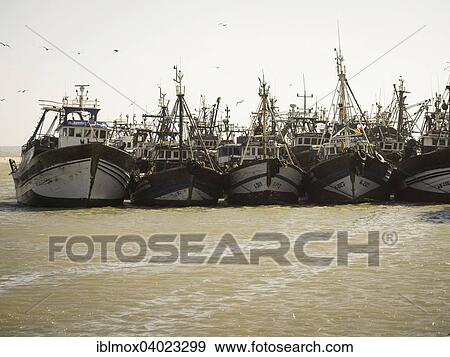 "Fishing boats in the port of Essaouira, Unesco World Heritage Site, Morocco, Africa" View Large Photo Image Stock Photo - "Fishing boats in the port of Essaouira, Unesco World Heritage Site, Morocco, Africa". Fotosearch