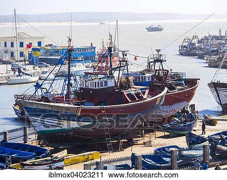 "Fishing boats in the yard, port of Essaouira, Unesco World Heritage Site, Morocco, Africa" View Large Photo Image Stock Image - "Fishing boats in the yard, port of Essaouira, Unesco World Heritage Site, Morocco, Africa". Fotosearch