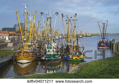 "Fishing boats moored in the fishing port, Greetsiel, Lower Saxony, Germany, Europe" View Large Photo Image Stock Photo - "Fishing boats moored in the fishing port, Greetsiel, Lower Saxony, Germany, Europe". Fotosearch