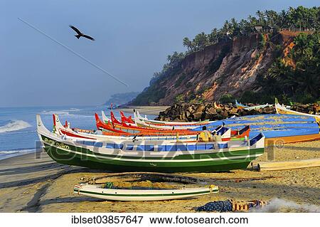 Stock Photo - "Fishing boats on the beach, Arabian Sea, Varkala, Kerala, South India, India, Asia". Fotosearch