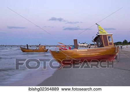 Stock Photo - "Fishing boats on the beach in the evening, Ahlbeck, Usedom Island, Mecklenburg-Western Pomerania, Germany, Europe". Fotosearch