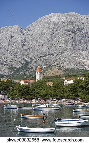 Stock Photo - "Fishing boats, the Biokovo Mountains at the back, Promajna, Makarska Riviera, Dalmatia, Croatia, Europe". Fotosearch