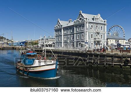 "Fishing cutter in front of the African Trading Port building, Victoria and Alfred Waterfront, Cape Town, Western Cape, South Africa, Africa" View Large Photo Image Stock Image - "Fishing cutter in front of the African Trading Port building, Victoria and Alfred Waterfront, Cape Town, Western Cape, South Africa, Africa". Fotosearch