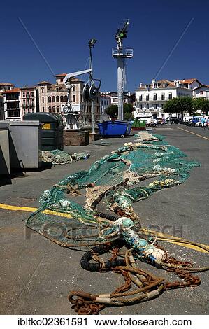 "Fishing nets in the fishing port of Saint-Jean-de-Luz, in Basque: Donibane Lohizune, Pyrenees, Aquitaine region, Pyrenees-Atlantiques department, France, Europe" View Large Photo Image Stock Image - "Fishing nets in the fishing port of Saint-Jean-de-Luz, in Basque: Donibane Lohizune, Pyrenees, Aquitaine region, Pyrenees-Atlantiques department, France, Europe". Fotosearch