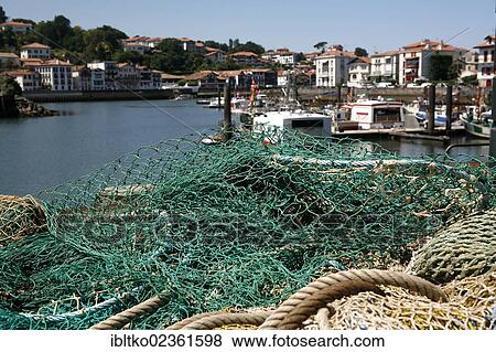 "Fishing nets in the fishing port of Saint-Jean-de-Luz, in Basque: Donibane Lohizune, Pyrenees, Aquitaine region, Pyrenees-Atlantiques department, France, Europe" View Large Photo Image Stock Photo - "Fishing nets in the fishing port of Saint-Jean-de-Luz, in Basque: Donibane Lohizune, Pyrenees, Aquitaine region, Pyrenees-Atlantiques department, France, Europe". Fotosearch