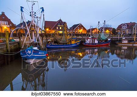 "Fishing port, shrimp boats in Neuharlingersiel, Lower Saxony, Germany, Europe" View Large Photo Image Stock Image - "Fishing port, shrimp boats in Neuharlingersiel, Lower Saxony, Germany, Europe". Fotosearch