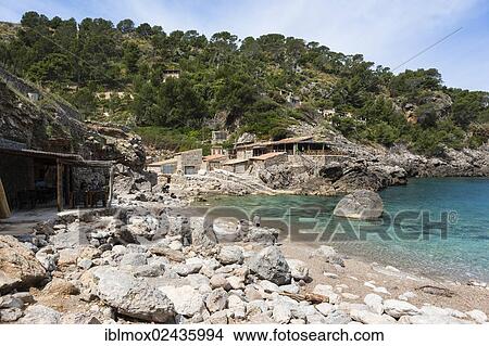 "Fishing village and hidden cove of Cala Deia, Deia, Serra de Tramuntana, northwest coast, Mallorca, Balearic Islands, Mediterranean Sea, Spain, Europe" View Large Photo Image Picture - "Fishing village and hidden cove of Cala Deia, Deia, Serra de Tramuntana, northwest coast, Mallorca, Balearic Islands, Mediterranean Sea, Spain, Europe". Fotosearch