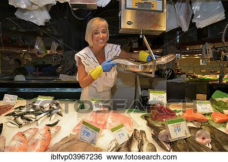 "Fishmonger at her stall in the market hall, Mercat de la Boqueria, also Mercat de Sant Josep, Barcelona,? Çï? ÇïCatalonia, Spain, Europe" View Large Photo Image Stock Photograph - "Fishmonger at her stall in the market hall, Mercat de la Boqueria, also Mercat de Sant Josep, Barcelona,? Çï? ÇïCatalonia, Spain, Europe". Fotosearch