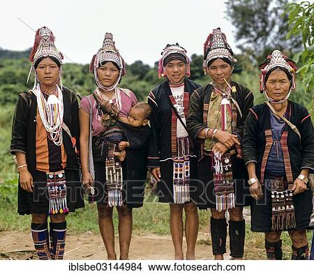 Picture - "Five Akha women in a mountain village, in traditional costume and headdress, Chiang Rai Province, Northern Thailand, Thailand, Asia". Fotosearch