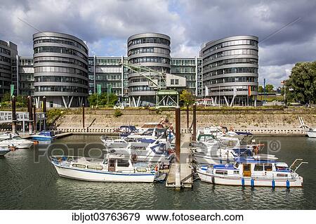 "Five Boats office building, marina, Innenhafen, Duisburg, Ruhr district, North Rhine-Westphalia, Germany, Europe" View Large Photo Image Stock Photo - "Five Boats office building, marina, Innenhafen, Duisburg, Ruhr district, North Rhine-Westphalia, Germany, Europe". Fotosearch