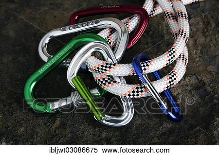 Five carabiner on rope on a stone surface View Large Photo Image Stock Photography - Five carabiner on rope on a stone surface. Fotosearch