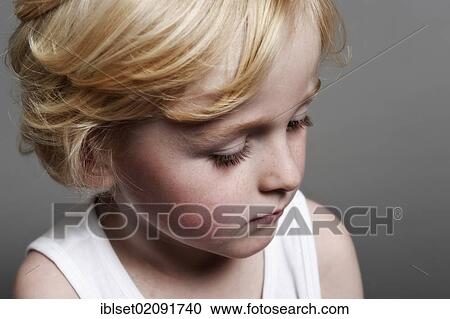 "Five-year-old boy looking down, portrait" View Large Photo Image Stock Image - "Five-year-old boy looking down, portrait". Fotosearch