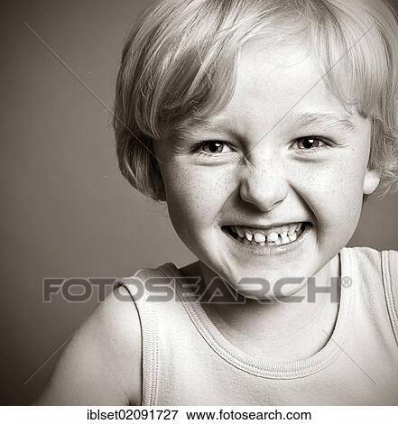 Stock Photo - "Five-year-old boy, smiling, portrait, black and white". Fotosearch