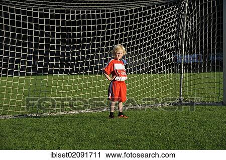 "Five-year-old boy wearing a FC Bayern Munich soccer dress, boredly standing in a soccer goal" View Large Photo Image Stock Image - "Five-year-old boy wearing a FC Bayern Munich soccer dress, boredly standing in a soccer goal". Fotosearch