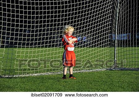 "Five-year-old boy wearing a FC Bayern Munich soccer dress, boredly standing in a soccer goal" View Large Photo Image Stock Photo - "Five-year-old boy wearing a FC Bayern Munich soccer dress, boredly standing in a soccer goal". Fotosearch