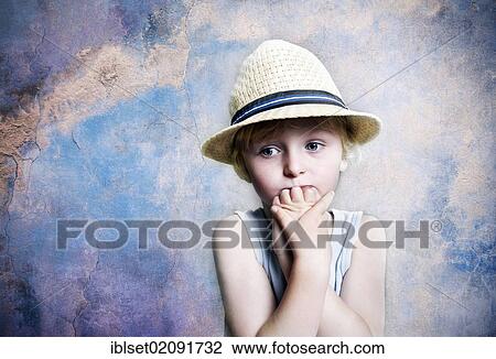 "Five-year-old boy wearing a hat, sad face, portrait" View Large Photo Image Stock Image - "Five-year-old boy wearing a hat, sad face, portrait". Fotosearch