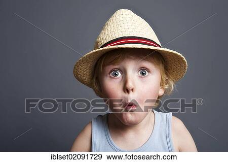 "Five-year-old boy wearing a hat, astonished face, funny portrait" View Large Photo Image Stock Photo - "Five-year-old boy wearing a hat, astonished face, funny portrait". Fotosearch