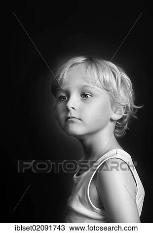 Stock Image - "Five-year-old boy wearing a white shirt, portrait, black and white". Fotosearch