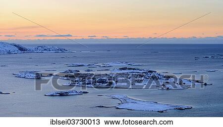 Stock Image - "Fjord with islands during the blue hour, Sommeroya, Tromso, â€ªTroms, Northern Norway, Norway, Europe". Fotosearch