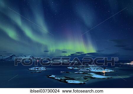 Picture - "Fjord with islands in winter and the northern lights, Sommeroya, Tromso, â€ªTroms, Northern Norway, Norway, Europe". Fotosearch