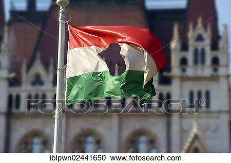 "Flag with a hole, commemorating the 1956 uprising outside Parliament, Budapest, Hungary, Europe" View Large Photo Image Stock Image - "Flag with a hole, commemorating the 1956 uprising outside Parliament, Budapest, Hungary, Europe". Fotosearch