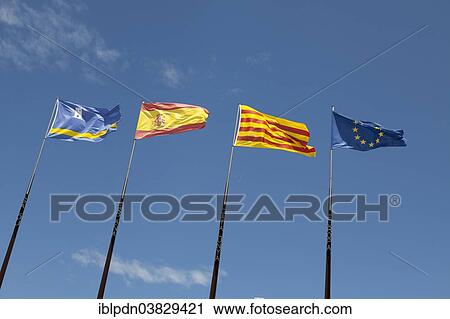 "Flags of Spanish regions on flagpoles against blue sky, Salou, Catalonia, Europe" View Large Photo Image Stock Image - "Flags of Spanish regions on flagpoles against blue sky, Salou, Catalonia, Europe". Fotosearch