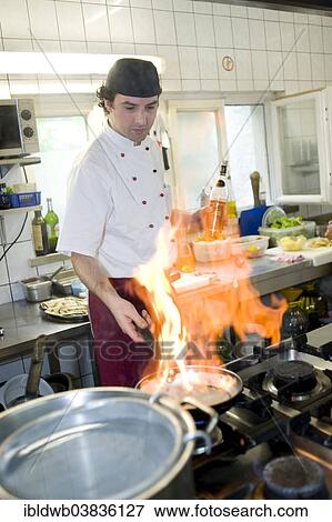 "Flambe cooking in a kitchen, Italian restaurant, Upper Bavaria, Bavaria, Munich, Germany, Europe" View Large Photo Image Stock Photo - "Flambe cooking in a kitchen, Italian restaurant, Upper Bavaria, Bavaria, Munich, Germany, Europe". Fotosearch