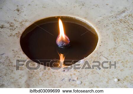 "Flame burning inside a big butterlamp, Kathmandu, Kathmandu District, Bagmati Zone, Nepal, Asia" View Large Photo Image Stock Photo - "Flame burning inside a big butterlamp, Kathmandu, Kathmandu District, Bagmati Zone, Nepal, Asia". Fotosearch