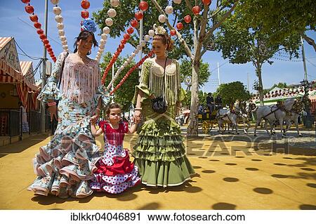 "Flamenco dancers and little girl at the Feria de Abril, Seville, Andalucia, Spain, Europe" View Large Photo Image Stock Image - "Flamenco dancers and little girl at the Feria de Abril, Seville, Andalucia, Spain, Europe". Fotosearch