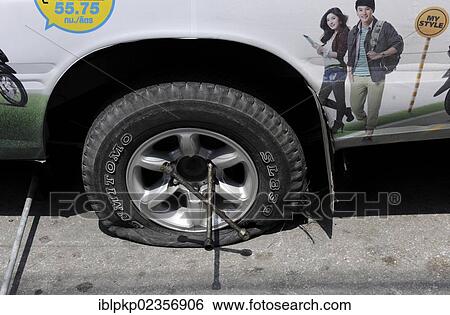 "Flat tyre, Chiang Mai, Thailand, Asia" View Large Photo Image Stock Photograph - "Flat tyre, Chiang Mai, Thailand, Asia". Fotosearch