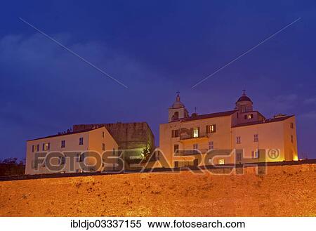 "Flood-lit houses inside the citadel (castle) of Calvi at the blue hour after sunset. Calvi is in the department Haute-Corse, France on the mediterranean island of Corsica, Calvi, Corsica, France, Europe" View Large Photo Image Stock Photography - "Flood-lit houses inside the citadel (castle) of Calvi at the blue hour after sunset. Calvi is in the department Haute-Corse, France on the mediterranean island of Corsica, Calvi, Corsica, France, Europe". Fotosearch