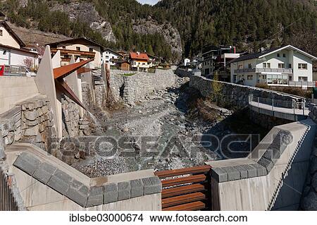 "Flood protection, flood dam on the Stubnerbach stream, Pfunds, Tyrol, Austria, Europe" View Large Photo Image Picture - "Flood protection, flood dam on the Stubnerbach stream, Pfunds, Tyrol, Austria, Europe". Fotosearch