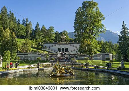 "Flora Fountain surrounded by a water basin, the Venus Temple and terraced gardens at the back, Konigslinde linden tree, castle grounds, Linderhof Palace, Upper Bavaria, Bavaria, Germany, Europe" View Large Photo Image Stock Image - "Flora Fountain surrounded by a water basin, the Venus Temple and terraced gardens at the back, Konigslinde linden tree, castle grounds, Linderhof Palace, Upper Bavaria, Bavaria, Germany, Europe". Fotosearch