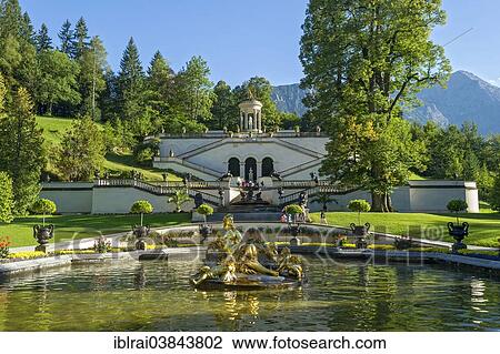 "Flora Fountain surrounded by a water basin, the Venus Temple and terraced gardens at the back, Konigslinde linden tree, castle grounds, Linderhof Palace, Upper Bavaria, Bavaria, Germany, Europe" View Large Photo Image Stock Image - "Flora Fountain surrounded by a water basin, the Venus Temple and terraced gardens at the back, Konigslinde linden tree, castle grounds, Linderhof Palace, Upper Bavaria, Bavaria, Germany, Europe". Fotosearch