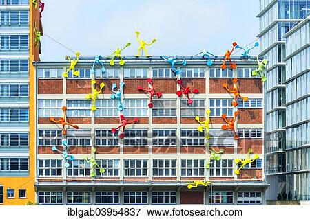 "Flossis figures, Roggendorf House, Medienhafen or Media Harbour, Dusseldorf, Rhineland, North Rhine-Westphalia, Germany, Europe" View Large Photo Image Stock Photo - "Flossis figures, Roggendorf House, Medienhafen or Media Harbour, Dusseldorf, Rhineland, North Rhine-Westphalia, Germany, Europe". Fotosearch