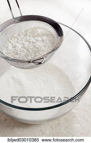 Flour being sieved into bowl View Large Photo Image Stock Photography - Flour being sieved into bowl. Fotosearch