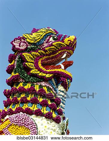 Stock Image - "Flower Festival, decorated floats, lion statue made from many flowers, Chiang Mai, Northern Thailand, Thailand, Asia". Fotosearch