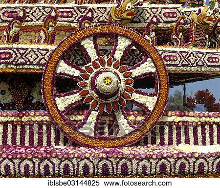 Stock Photography - "Flower Festival, decorated floats, wheel of life made from many flowers, Chiang Mai, Northern Thailand, Thailand, Asia". Fotosearch